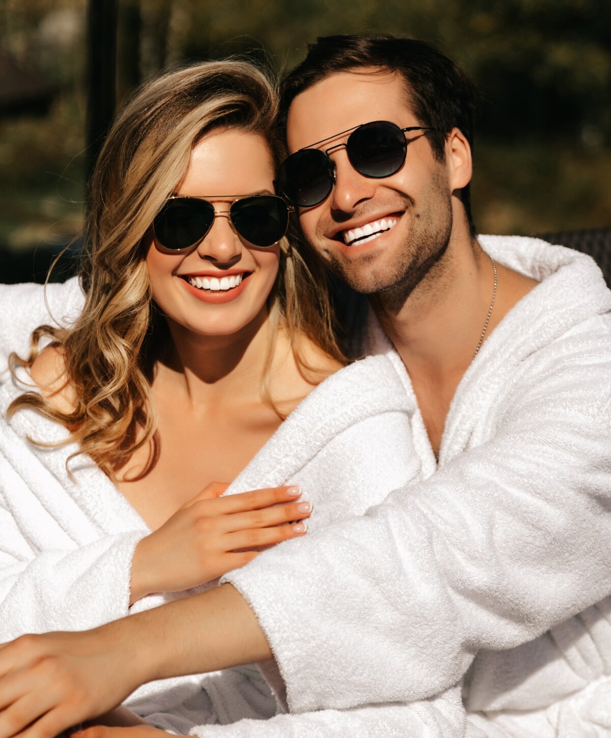 Beverly Hills dental veneers patient models smiling and embracing